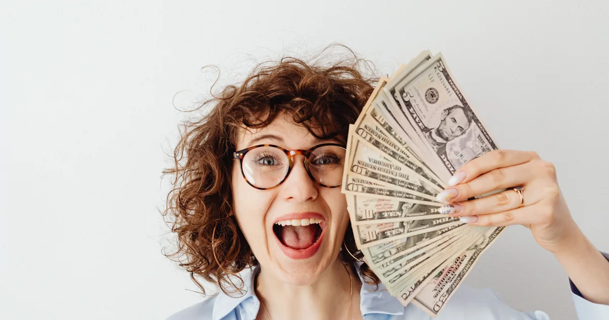 Loans like Credit Cube alternatives — woman celebrating funds